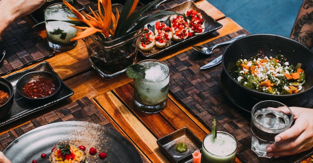 Delicious gourmet meals and drinks on a rustic dining table, perfect for culinary enthusiasts.